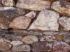 Rock wall side of old rustic building at the Vulture Mine tour